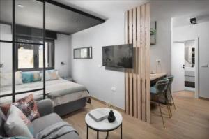 a bedroom with a bed and a desk in a room at NOVIGRAD Ema 2 in Novigrad Istria