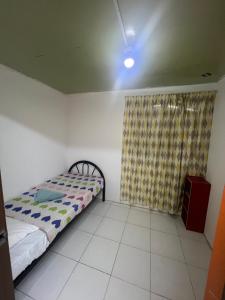 Ένα ή περισσότερα κρεβάτια σε δωμάτιο στο maythomestay +1 φωτογραφίες