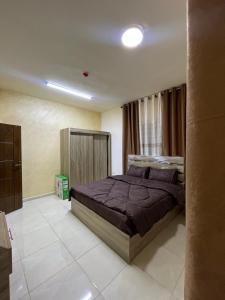 a bedroom with a large bed in a room at Osama Alnaser in Amman