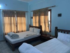 Postelja oz. postelje v sobi nastanitve Sauraha Guest House