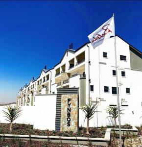 a large white building with a flag in front of it at Luxurious Lifestyle in Cape Town