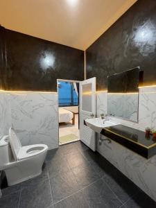 a bathroom with a toilet and a sink and a tub at Baan rabianglay 2 in Ban Hin Sam Kon +82 photos