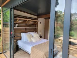 Postel nebo postele na pokoji v ubytování Le Chalet Montégut