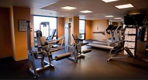 a gym with several tread machines in a room at Suites at Marriott's Grand Chateau Las Vegas-No Resort Fee in Las Vegas