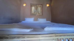 Letto o letti in una camera di Massel Belosso