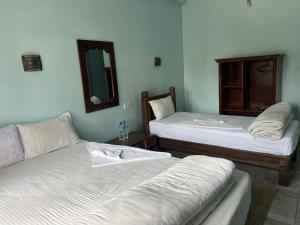 Postelja oz. postelje v sobi nastanitve Sauraha Guest House