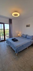 Кровать или кровати в номере SunScape Corbu