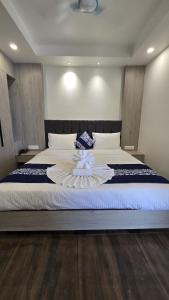 Postel nebo postele na pokoji v ubytování Hotel Akshaya