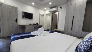 Postel nebo postele na pokoji v ubytování Hotel Akshaya