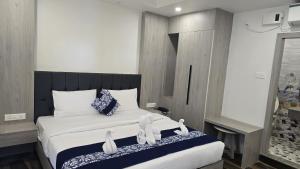 Postel nebo postele na pokoji v ubytování Hotel Akshaya