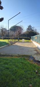 a park with a street light next to a sidewalk at Studio plein Sud au calme in Montauban