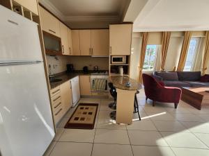 A kitchen or kitchenette at Antalya belek 4 nirvana club first floor two bedrooms pool view with water slide close to center - belek beach park