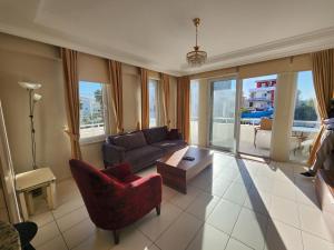 A seating area at Antalya belek 4 nirvana club first floor two bedrooms pool view with water slide close to center - belek beach park Még 37 kép