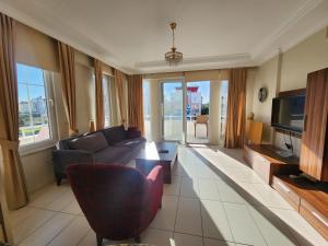 A television and/or entertainment centre at Antalya belek 4 nirvana club first floor two bedrooms pool view with water slide close to center - belek beach park