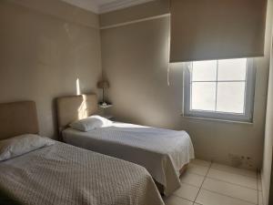 A bed or beds in a room at Antalya belek 4 nirvana club first floor two bedrooms pool view with water slide close to center - belek beach park
