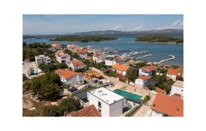 an aerial view of a town next to a body of water at 4 Bedroom Stunning Home In Murter in Murter