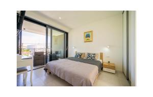 a bedroom with a bed and a balcony at 4 Bedroom Stunning Home In Murter in Murter +35 photos