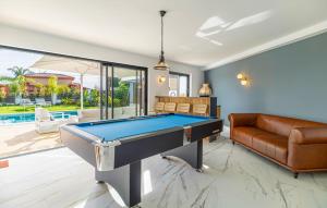 a living room with a pool table and a couch at Amazing Villa With Heated Pool in Benalmádena