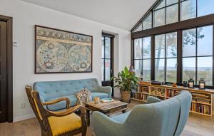 a living room with a couch and chairs and a table at Nice Home In Odder With House Sea View in Odder