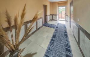 a hallway with a potted plant in a house at Beautiful Apartment In Saint Chinian in Saint-Chinian