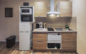 a small kitchen with a sink and a microwave at Beautiful Apartment In Saint Chinian in Saint-Chinian