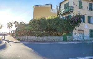 a building on the side of a street with a house at Nice Home In Ventimiglia in Ventimiglia +31 photos