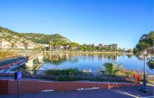 a view of a lake with trees and buildings at Nice Home In Ventimiglia in Ventimiglia