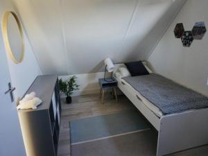 a small room with a bed and a desk at Beautiful Villa close to beaches in Sint Maarten +18 photos