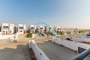 a view from the balcony of a building with a water park at Special Rate with Temp Controlled Pool, BBQ & Maid's by Deluxe Holiday Homes in Fujairah