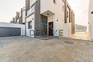 a view of the front of a house at Special Rate with Temp Controlled Pool, BBQ & Maid's by Deluxe Holiday Homes in Fujairah