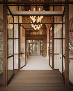 an open hallway with a chandelier in a building at Van Oys Maastricht Retreat, a Leading Hotel of the World in Eijsden