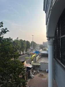 a view of a city with a building and a street at Talupula oceanic view apartments in Visakhapatnam