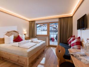 Krevet ili kreveti u jedinici u okviru objekta Hotel Ritterhof Ellmau
