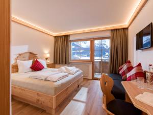 Krevet ili kreveti u jedinici u okviru objekta Hotel Ritterhof Ellmau