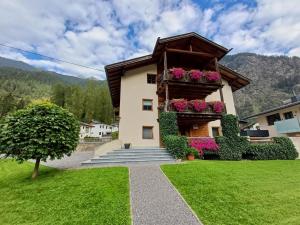 a house with flowers on the side of it at Haus Gstrein in Oetz