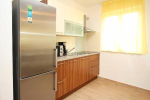 Kuchyň nebo kuchyňský kout v ubytování Apartments Smojver Stipe