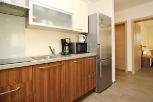 Kuchyň nebo kuchyňský kout v ubytování Apartments Smojver Stipe