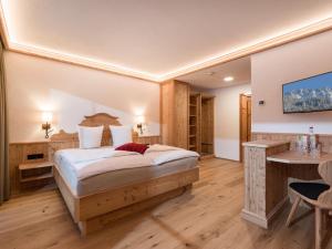 Krevet ili kreveti u jedinici u okviru objekta Hotel Ritterhof Ellmau