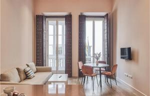 a living room with a couch and a table at Awesome Apartment In Cádiz With Kitchen in Cádiz