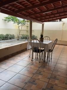 a table and chairs sitting on a patio at Casa Aconchego Itaici in Caldas Novas