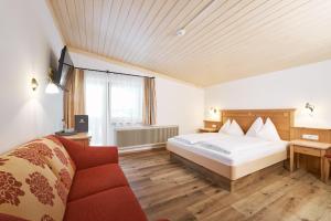 Postel nebo postele na pokoji v ubytování Hotel Vorderronach