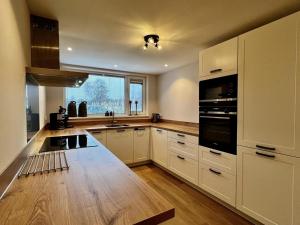 Kuchyň nebo kuchyňský kout v ubytování Modern & cozy holiday home near beach