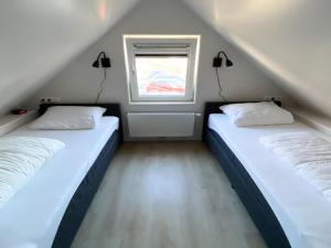 Postel nebo postele na pokoji v ubytování Modern & cozy holiday home near beach