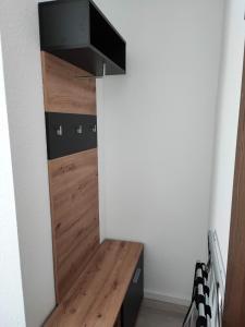 a room with a wooden desk in a wall at City Rooms Rastatt in Rastatt +7 photos