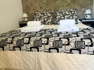 Ένα ή περισσότερα κρεβάτια σε δωμάτιο στο Cabañas del Fuego