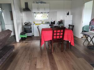 a kitchen and dining room with a table and chairs at Altos del parque in Minas