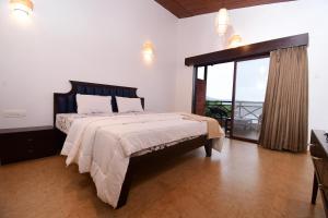 Krevet ili kreveti u jedinici u okviru objekta Waves and Vibes Resort
