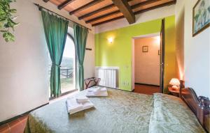 a bedroom with a bed with two towels on it at Lovely Home In Dicomano With Wifi in Dicomano