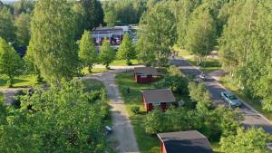 an aerial view of a campground with trees and a road at Pitkämö Canyon Camping Oy in Kurikka
