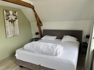 Ένα ή περισσότερα κρεβάτια σε δωμάτιο στο Holiday home near dunes, beach, sea